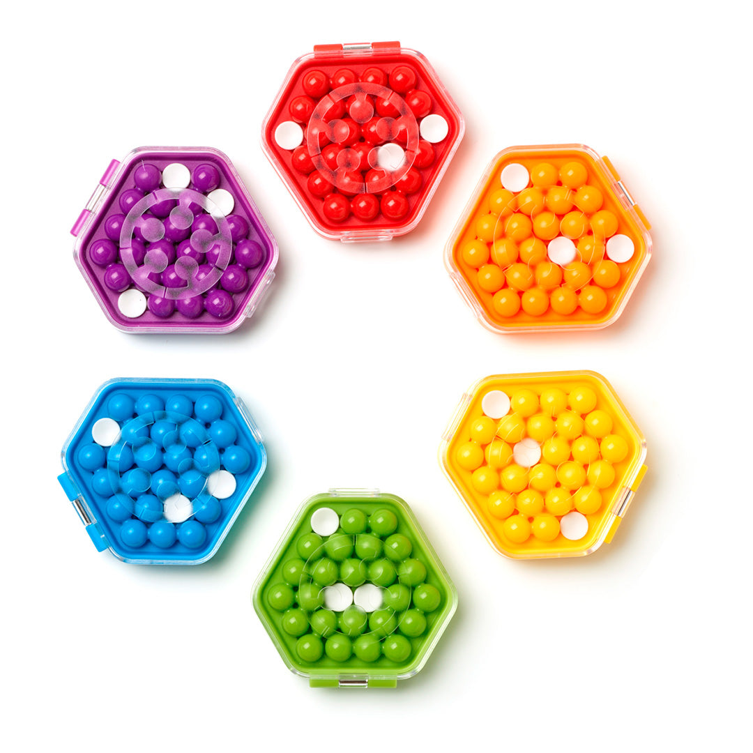 Photo of six different coloured versions of IQ Mini Hexpert mind puzzle by Smart Games.